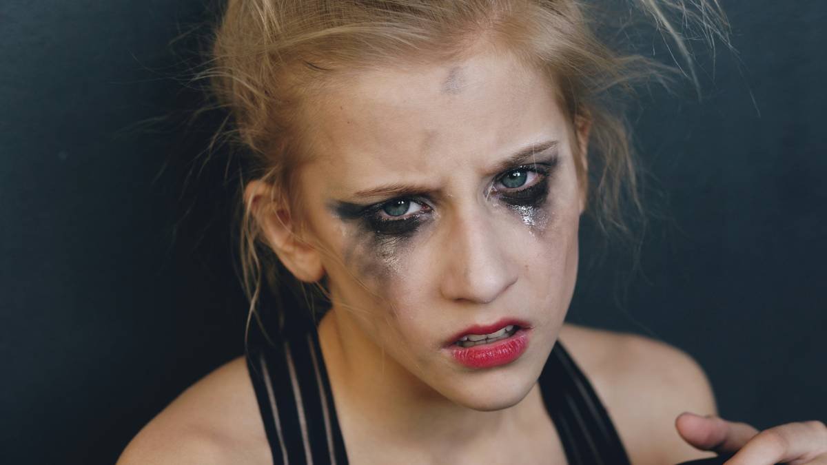 Medical reference chart showing visual differences between first to fourth-degree burn injuries with corresponding makeup translation examples