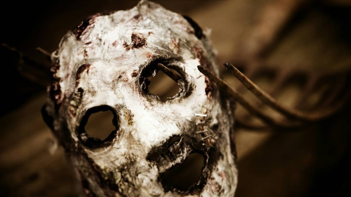 A creepy looking mask with holes in it