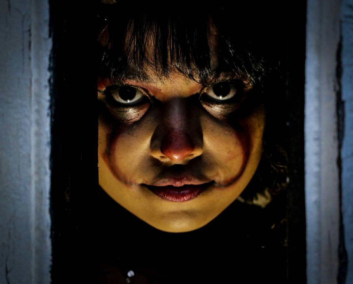 a close up of a person with a creepy look on their face
