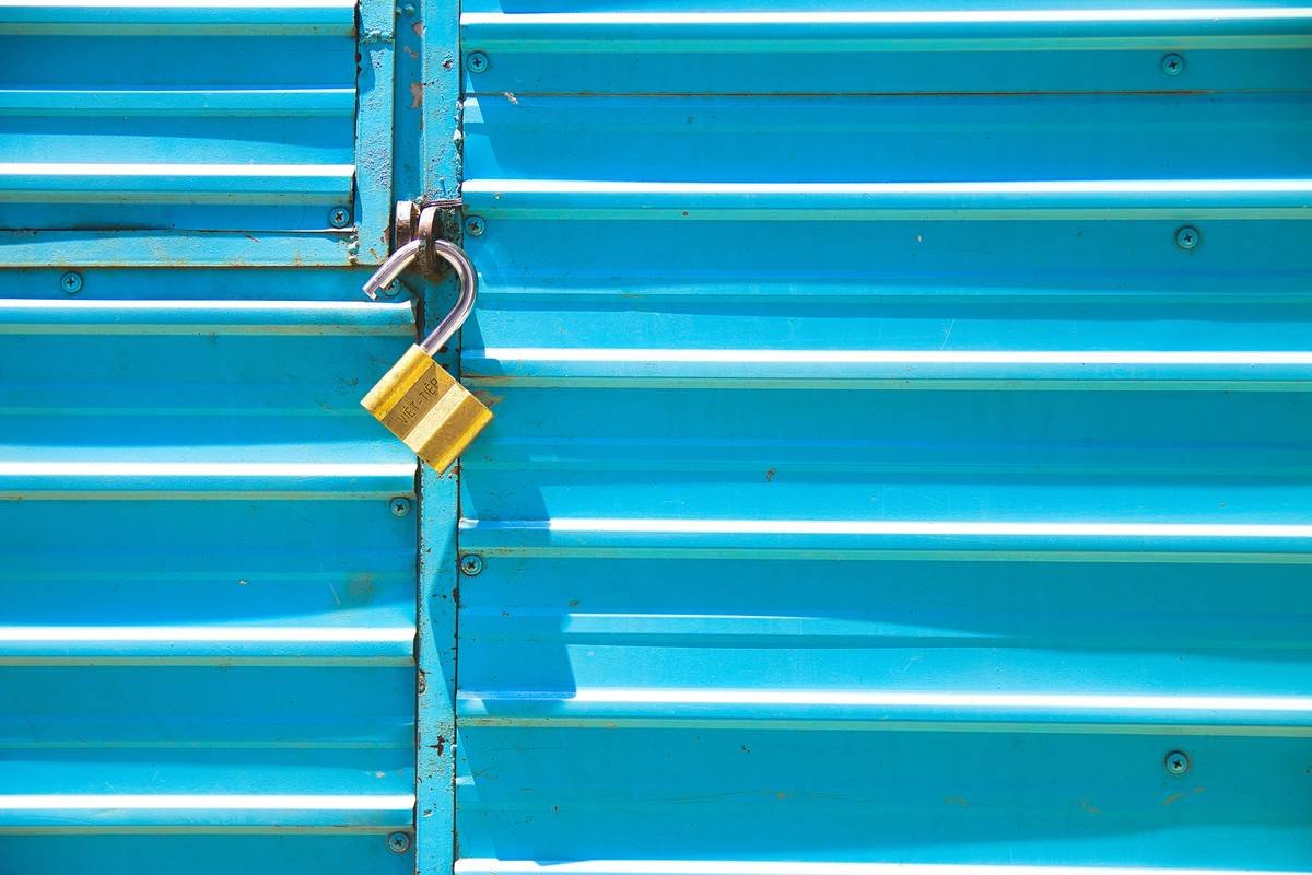 a padlock on the side of a blue container